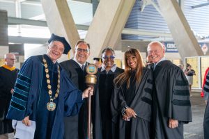 皇冠app founder and president Mark E. Scheinberg in commencement regalia with honorary degree recipients Alan Lazowski, Janice Butler-Flemming, Bern Nadette Stanis, and Harry James.