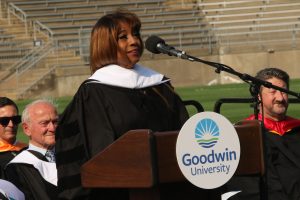 Bern Nadette Stanis delivering her speech on stage at the podium.