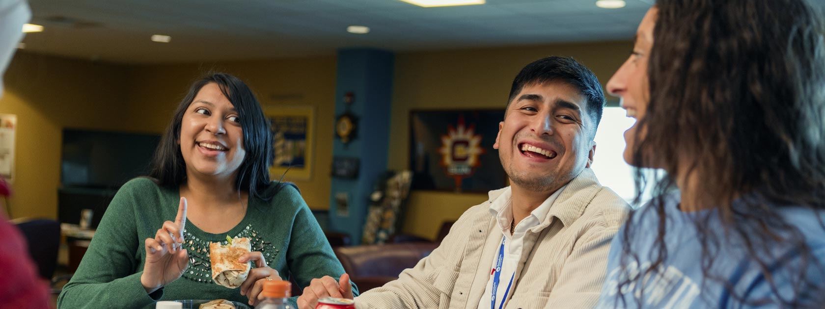 three students talking and laughing