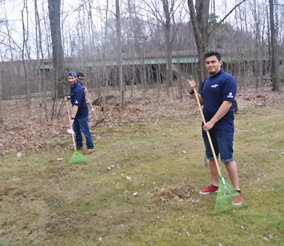 Two students doing volunteer work