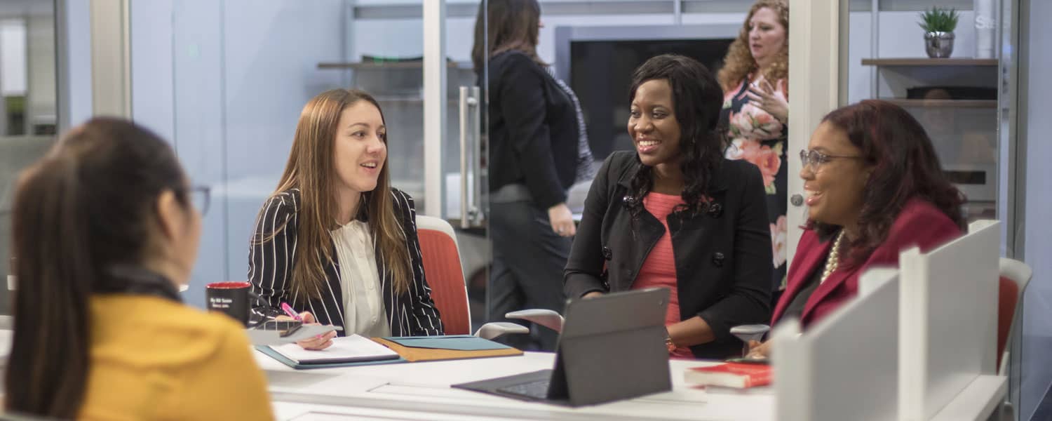 a group of business students talking