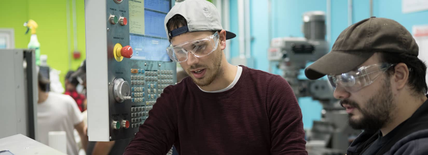 Two CNC students working on a project
